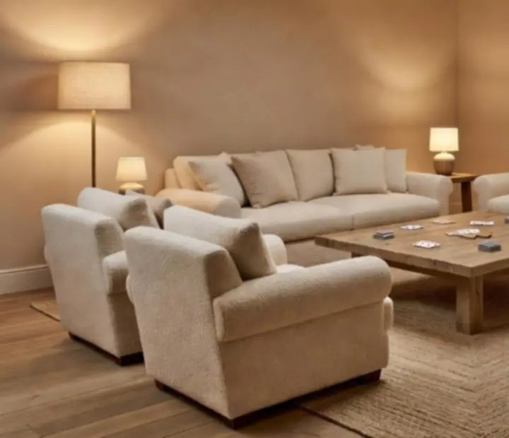Plush lounge seating with soft ambient lighting in the card room